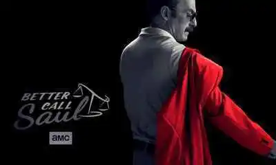 In this promotional image, Gene (the Saul from the present) dons a red jacket in an otherwise black-and-white photo, symbolizing his former self as the conman, Saul Goodman.